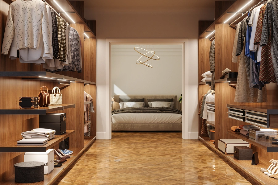 Spacious walk-in closet leading to bedroom.