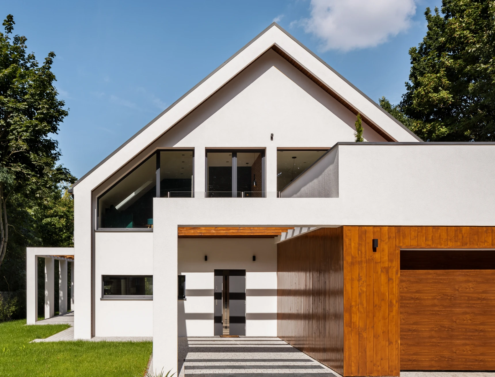 Modern white house with wooden accents.
