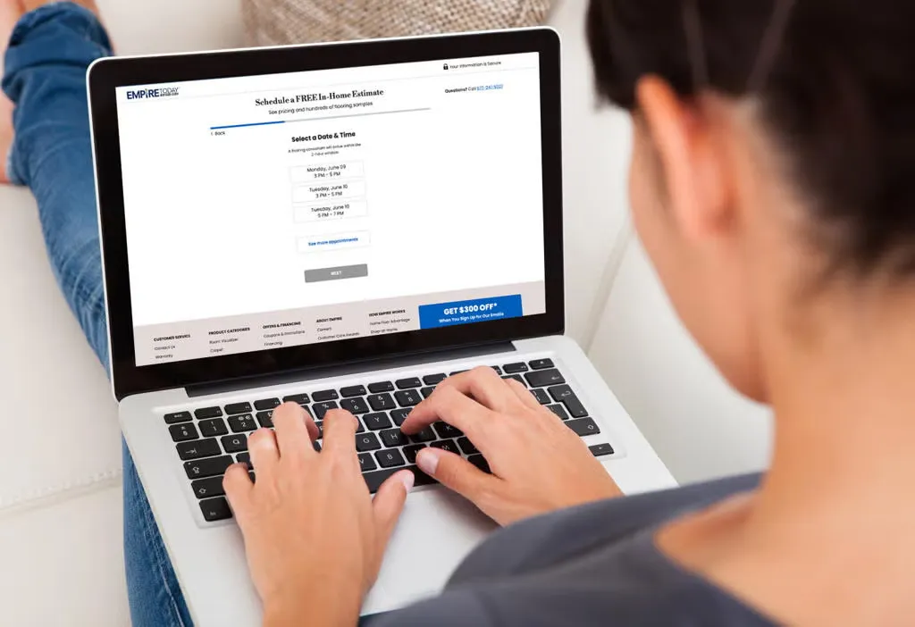 Person booking DMV appointment on laptop.