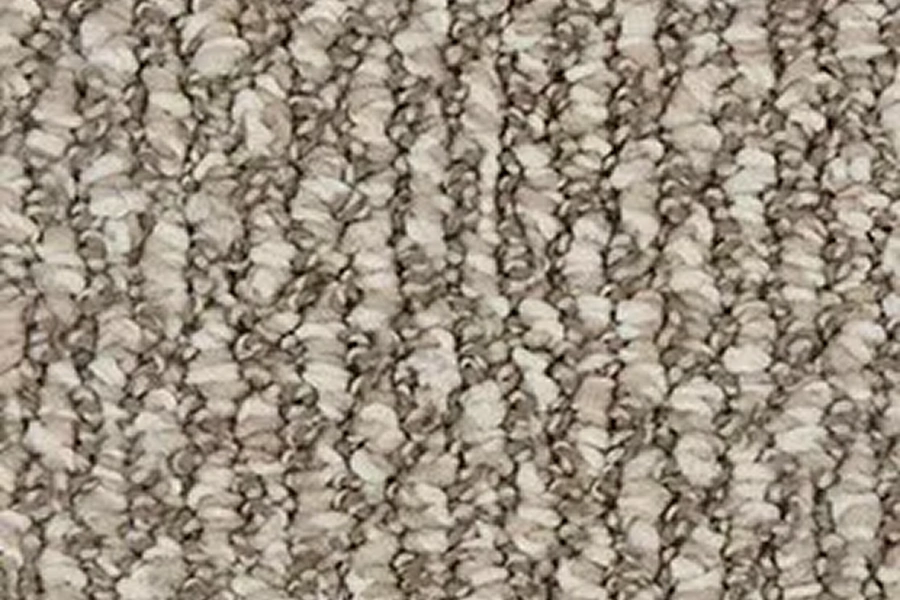 Beige textured carpet with loop pattern.