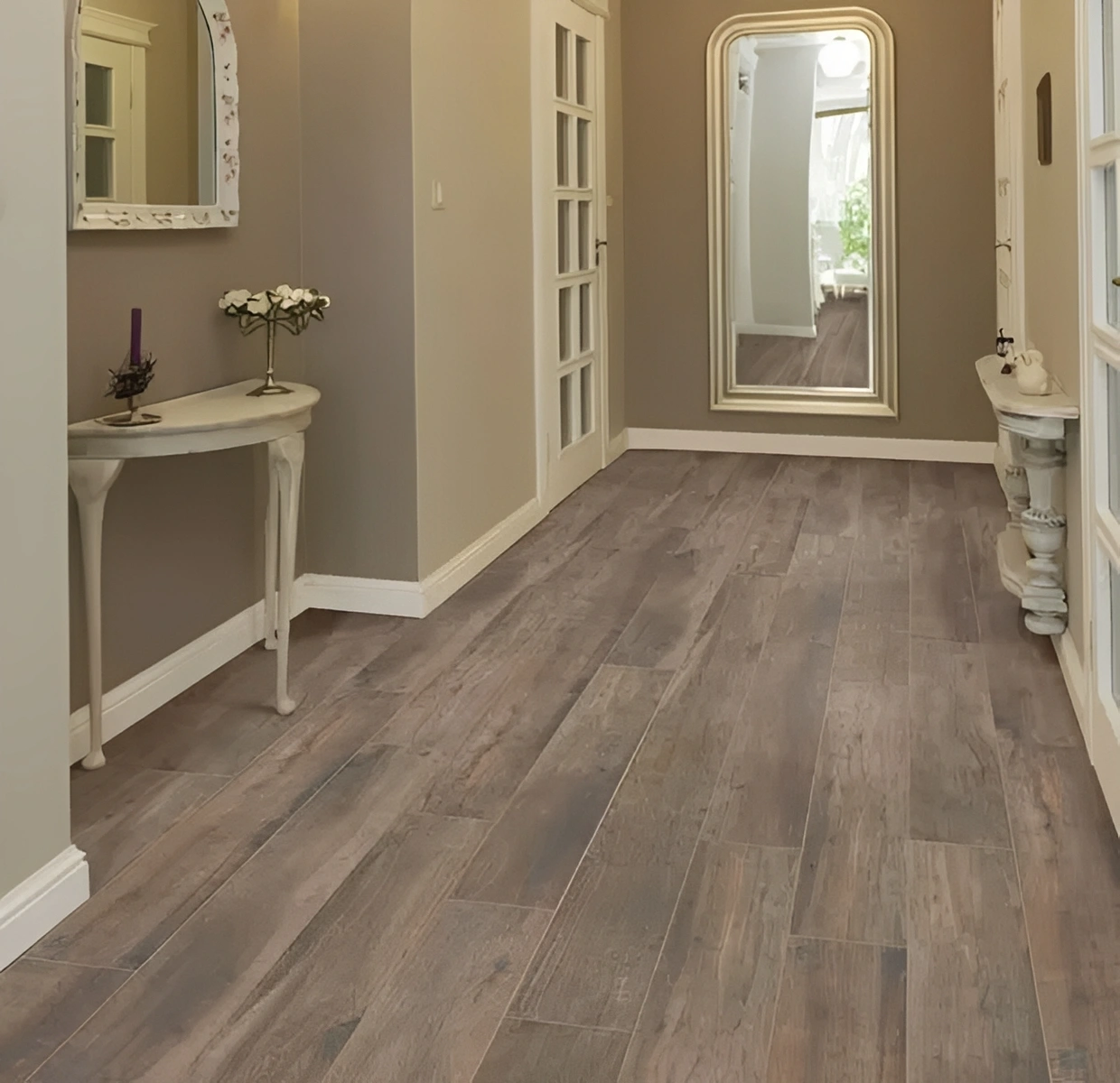 Elegant hallway with wooden flooring and mirror.