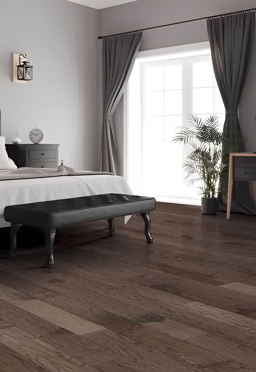 Modern bedroom with dark wooden flooring.