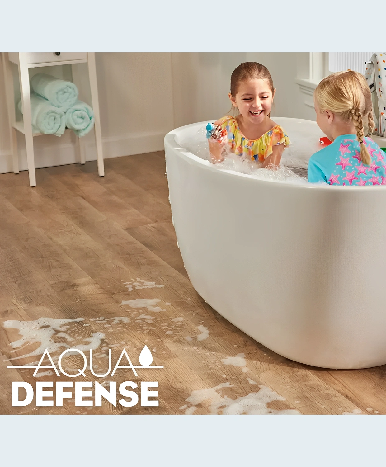 Children playing in bathtub, water on floor.
