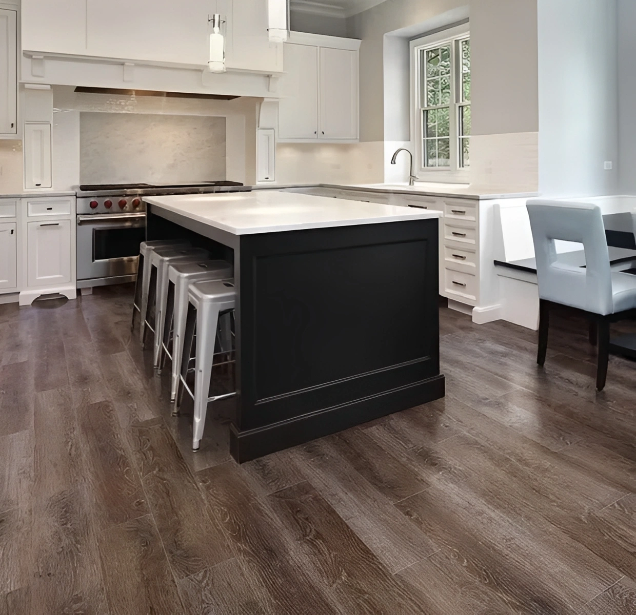 Modern kitchen with island and bar stools.