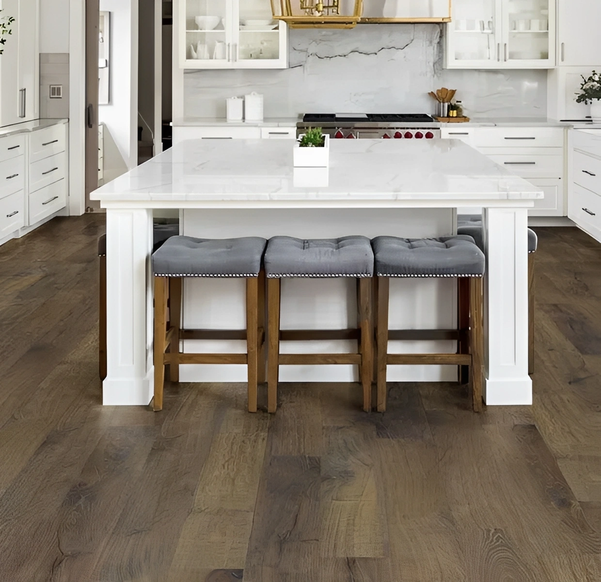 Modern kitchen with island and bar stools.