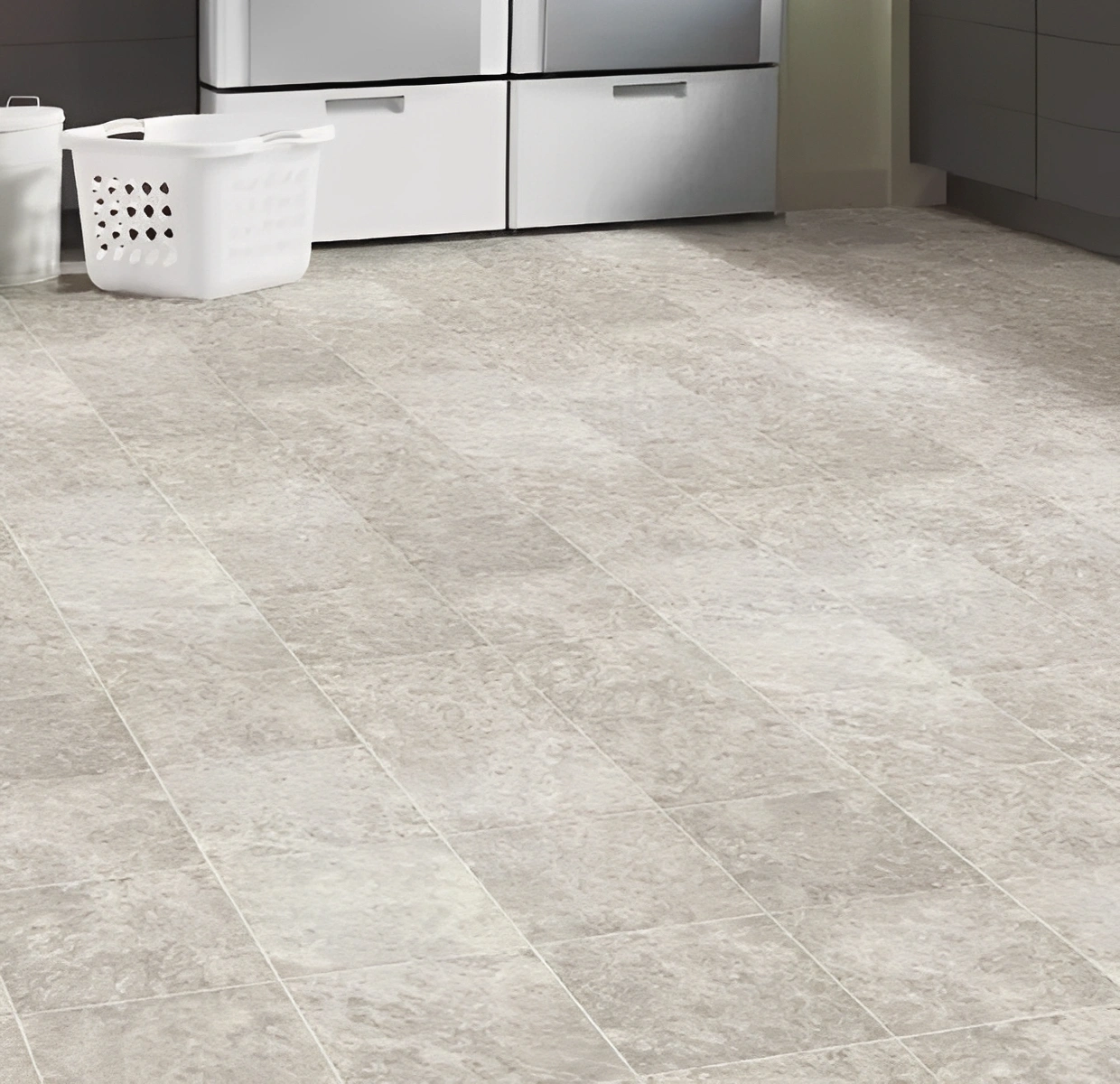 Laundry basket on tiled kitchen floor.