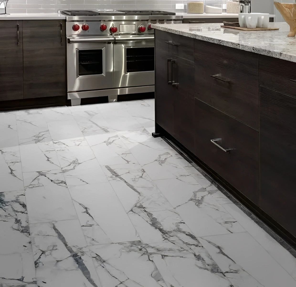 Modern kitchen with marble floor and counters.