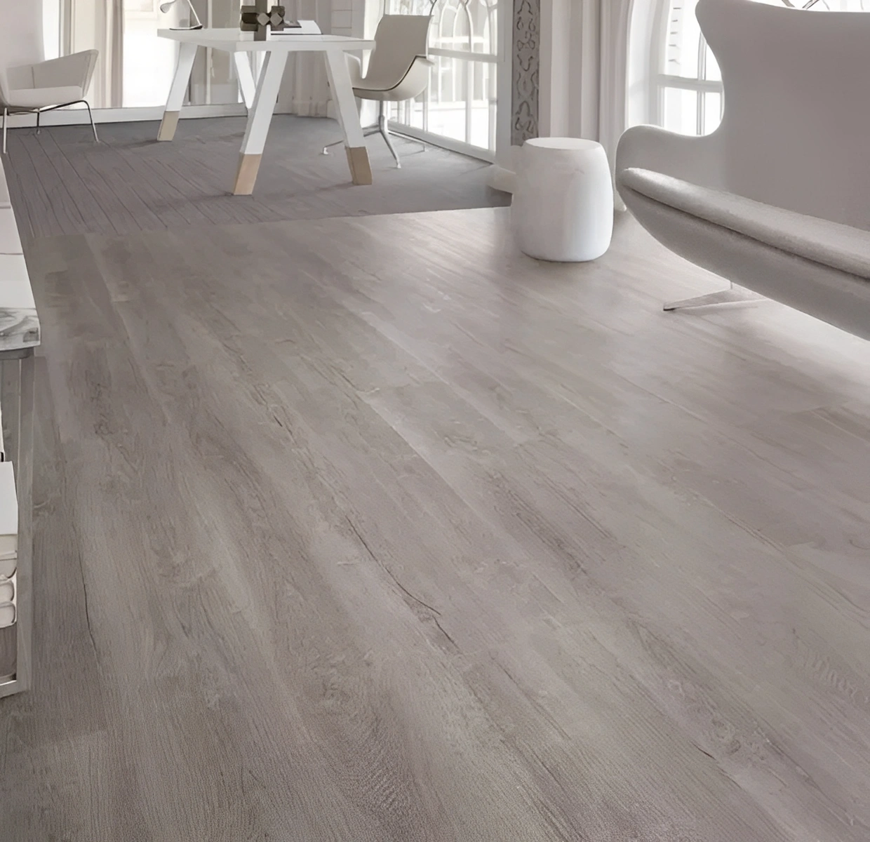 Modern room with light wood flooring.